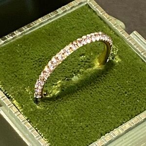 Gorgeous 14K Yellow Gold Eternity Band filled with tiny round White Sapphires